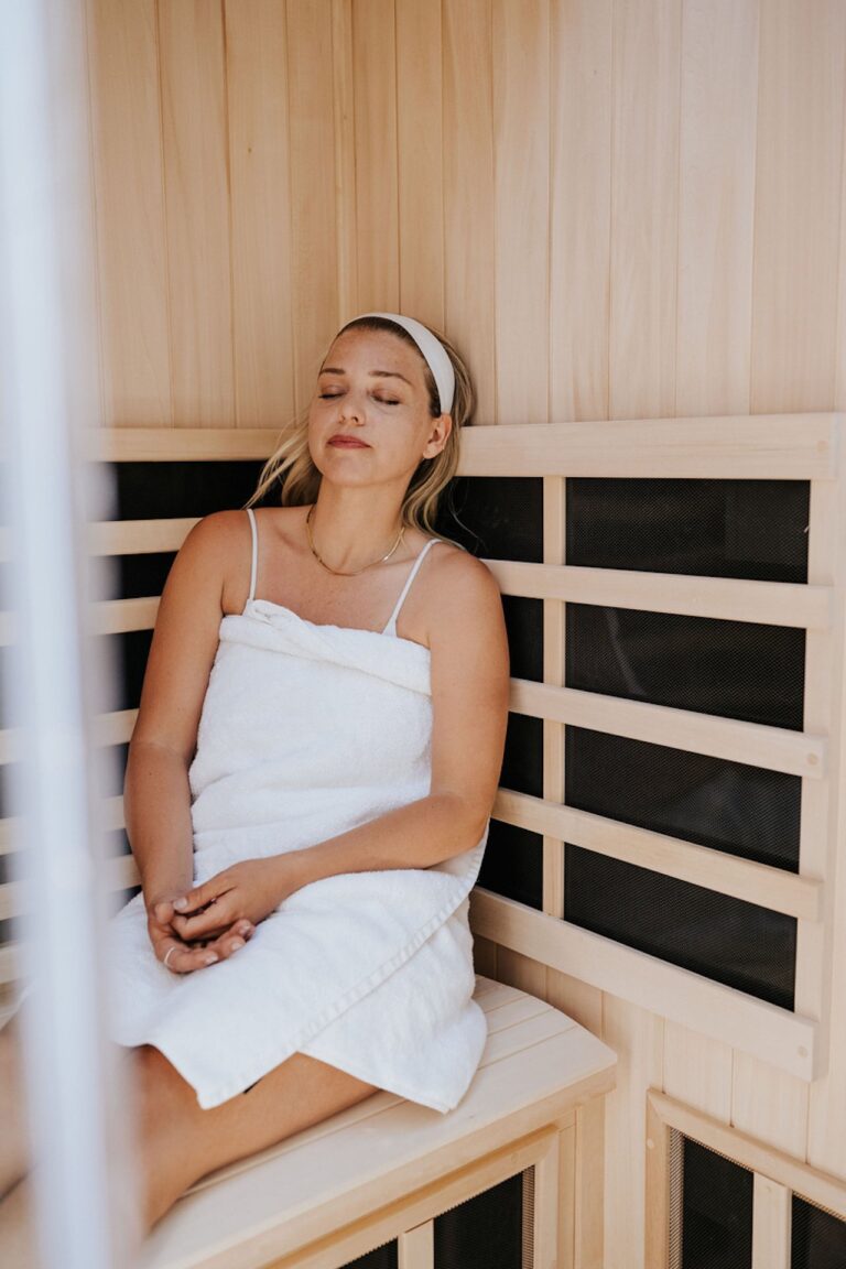 woman sitting in sauna